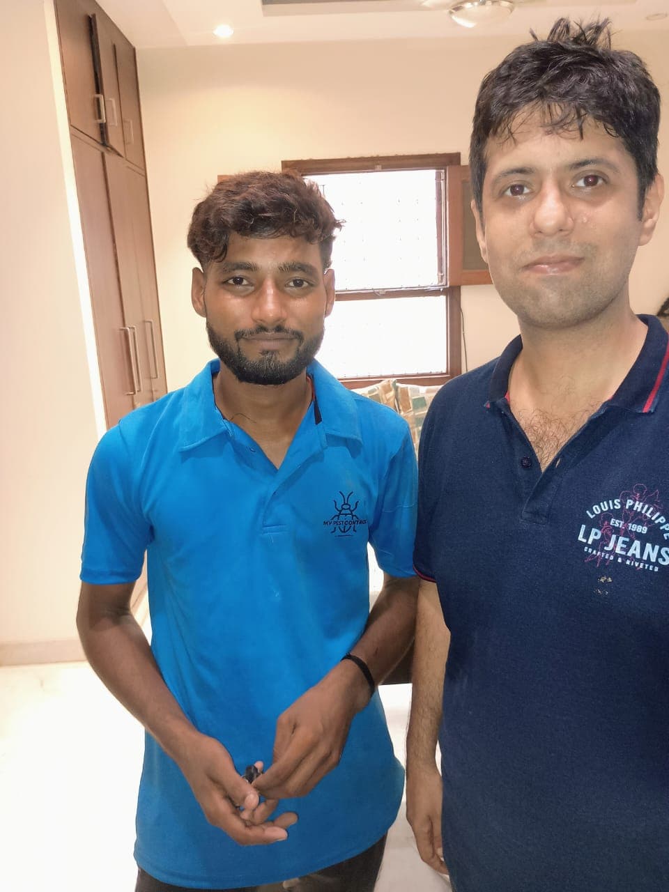 M V Pest Control technician with happy customer
